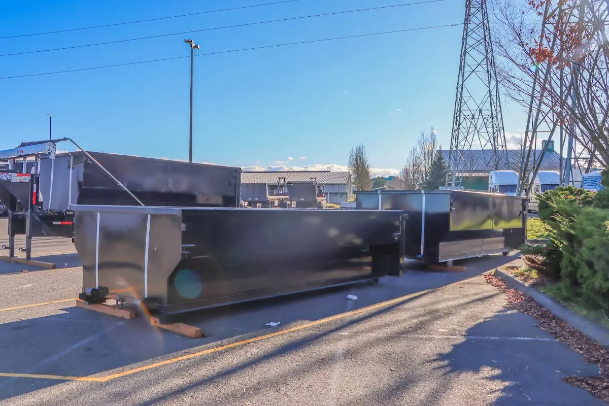 Roll-off dumpster ready for waste disposal at job site for 2 Yard Dumpster Rental in Alma